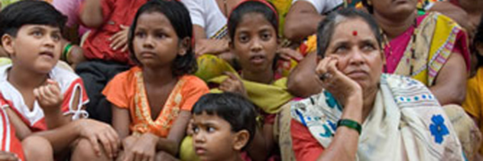 Woman sitting with children in India